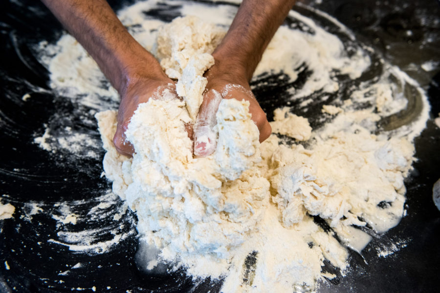 Mixing bread dough with hands